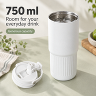 White 750ml stainless steel tumbler holding iced water beside its dual-drink lid
