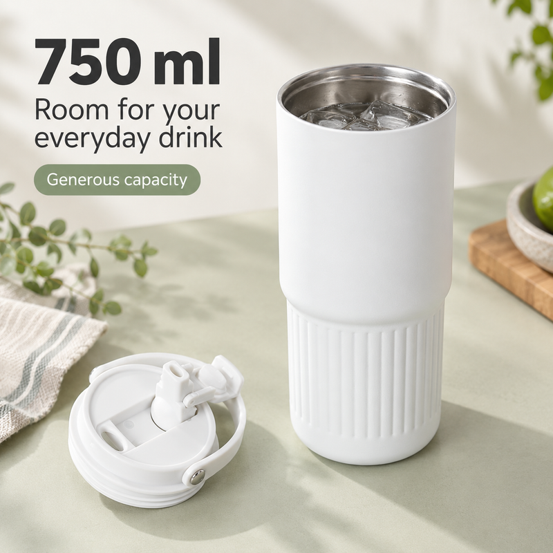 White 750ml stainless steel tumbler holding iced water beside its dual-drink lid