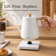 White electric gooseneck kettle lifted above its separate matching power base