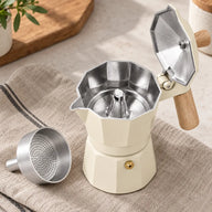 Open moka pot showing aluminum interior and removable funnel basket