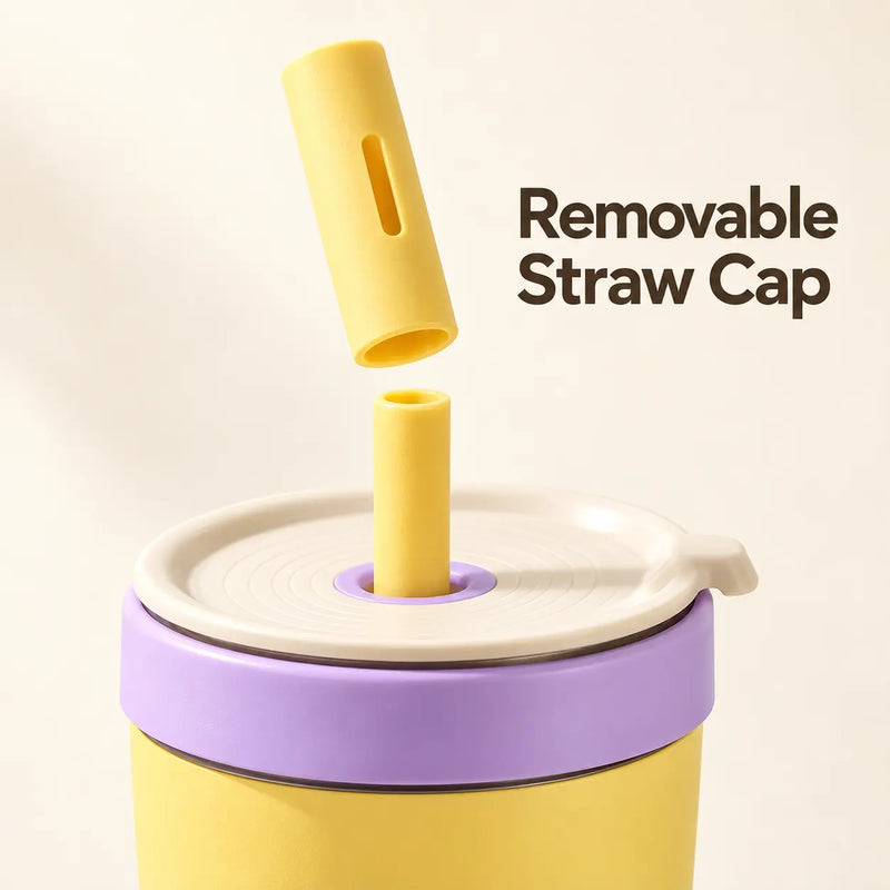 Yellow removable straw dust cap above the drinking straw and cream lid