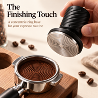 Concentric-ring stainless steel tamper base beside a freshly tamped coffee puck