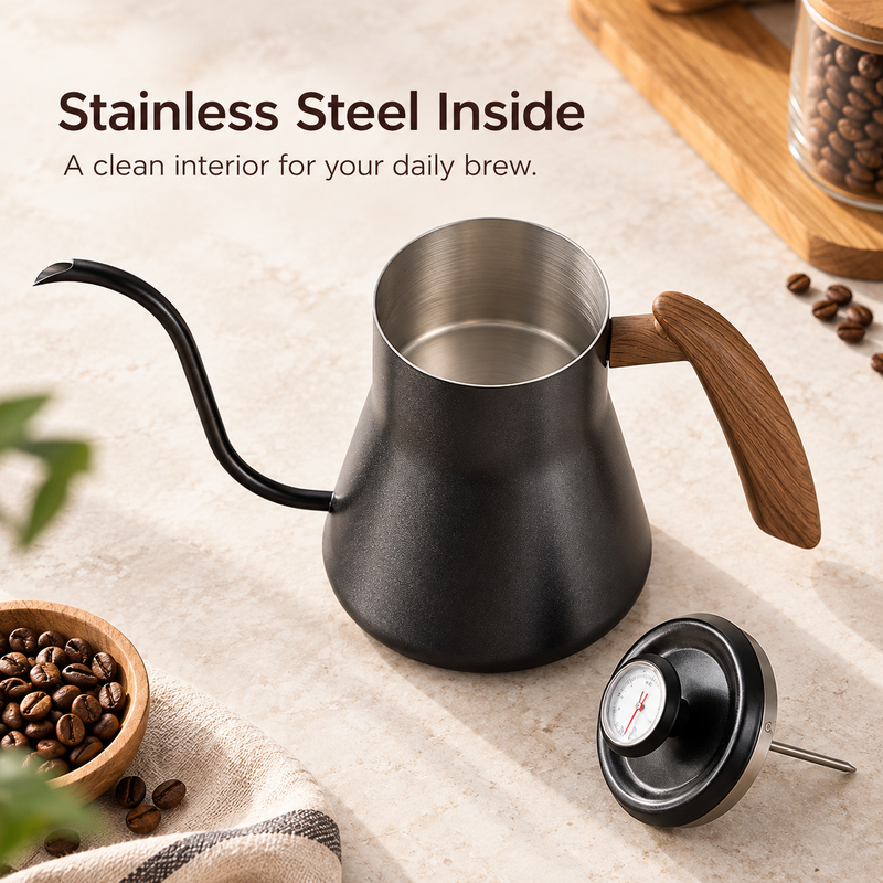 Open black kettle showing its stainless steel interior and removable thermometer lid