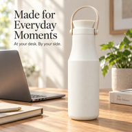 Ivory Yozcoffee insulated bottle on a sunlit desk beside a laptop