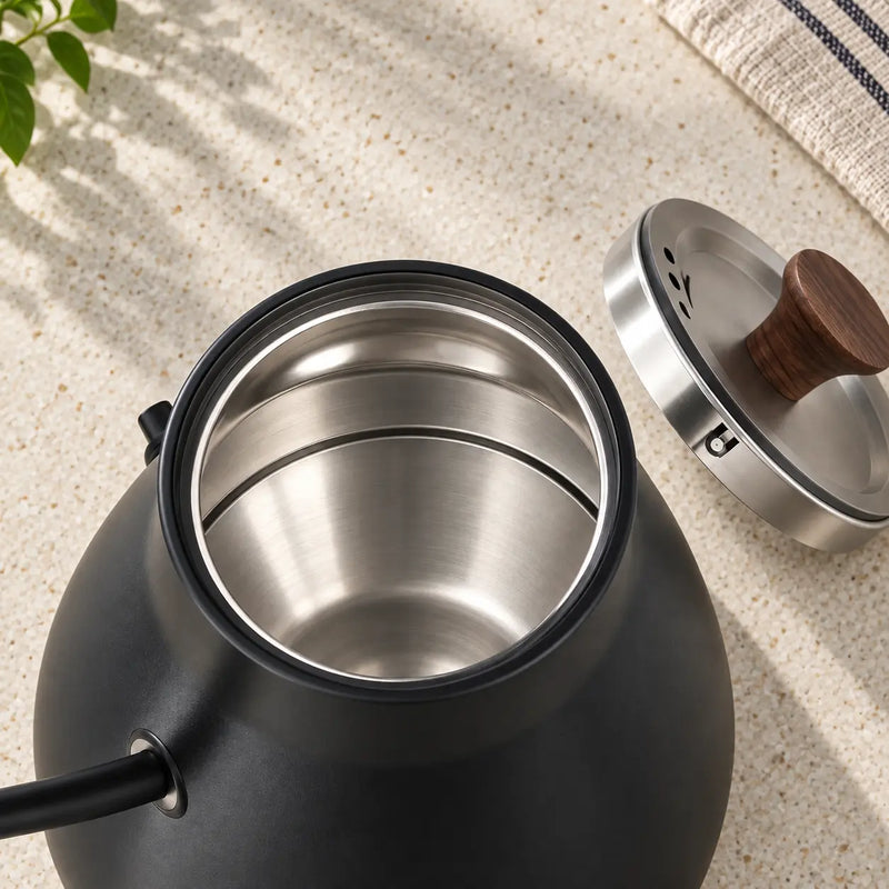 Open Yozcoffee electric kettle showing its stainless steel interior and removable lid