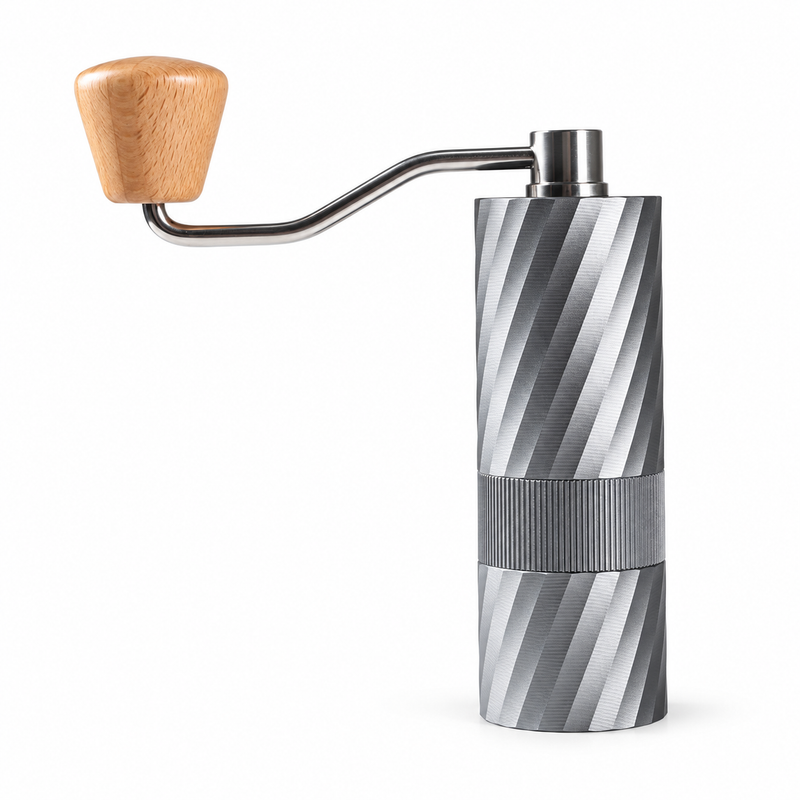 Grey Yozcoffee manual coffee grinder with textured center grip band and wood-knob crank on white