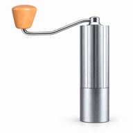 Silver Yozcoffee manual coffee grinder with fluted aluminum body, wood crank knob and detachable grounds cup on white background