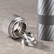 Close-up illustration of the Yozcoffee manual grinder stainless steel conical burr and outer burr