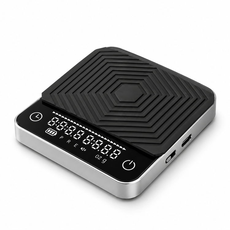 Black espresso coffee scale with removable silicone pad on white background
