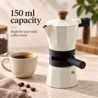 White 150ml thermostat moka pot beside a coffee cup