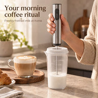 Yozcoffee rechargeable milk frother whisking milk through the cup lid in a home kitchen
