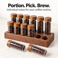 12 coffee bean tubes with two removed from their walnut holder for individual use