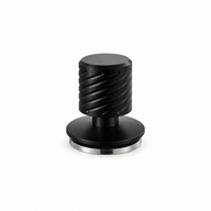 Yozcoffee matte black spring-loaded espresso tamper on white with grooved handle and silver stainless steel base