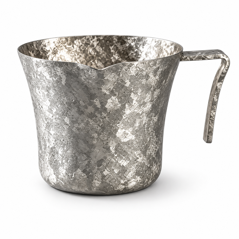 Single ice-silver Yozcoffee pure titanium espresso measuring cup on white background, showing pour spout and folded handle