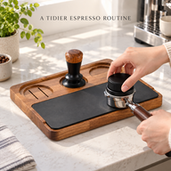 Walnut espresso tamping station in use with a portafilter on its black work pad