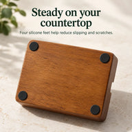 Underside of the wood espresso organizer showing four round silicone feet