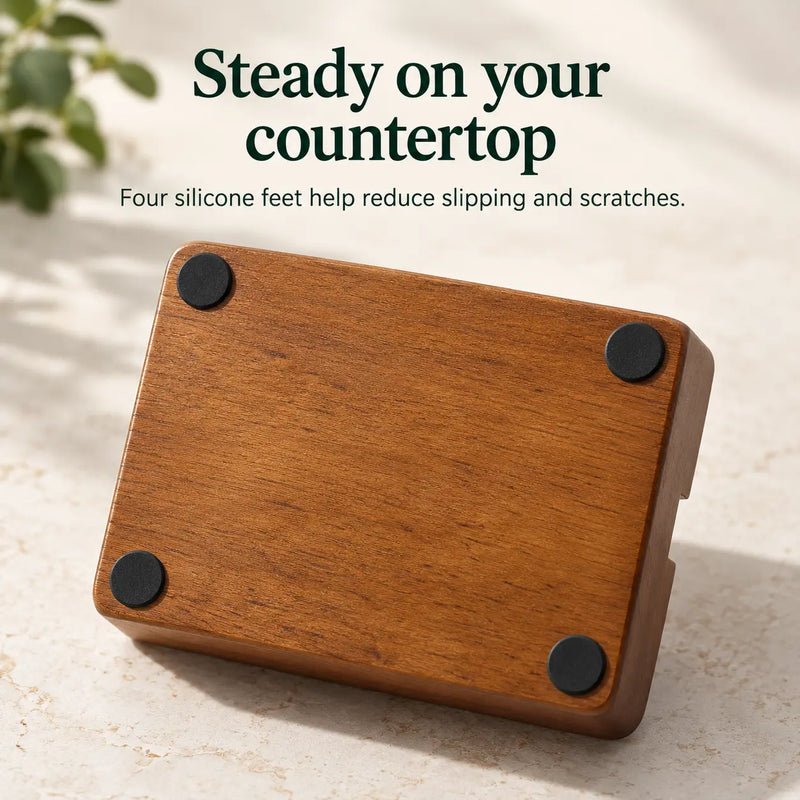 Underside of the wood espresso organizer showing four round silicone feet
