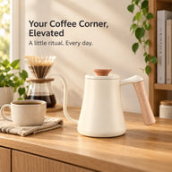 Ivory Yozcoffee gooseneck kettle with pale wooden handle on a home coffee counter